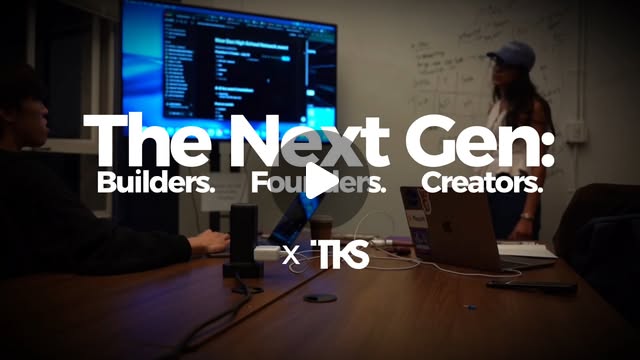 Opening title frame of the launch reel — students working at laptops